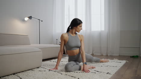 woman stretching at home