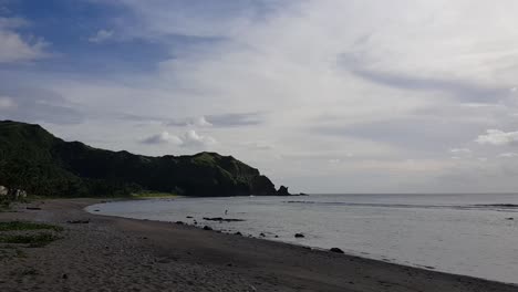 High-hills-behind-a-beach-shore-in-Batanes,-Philippines