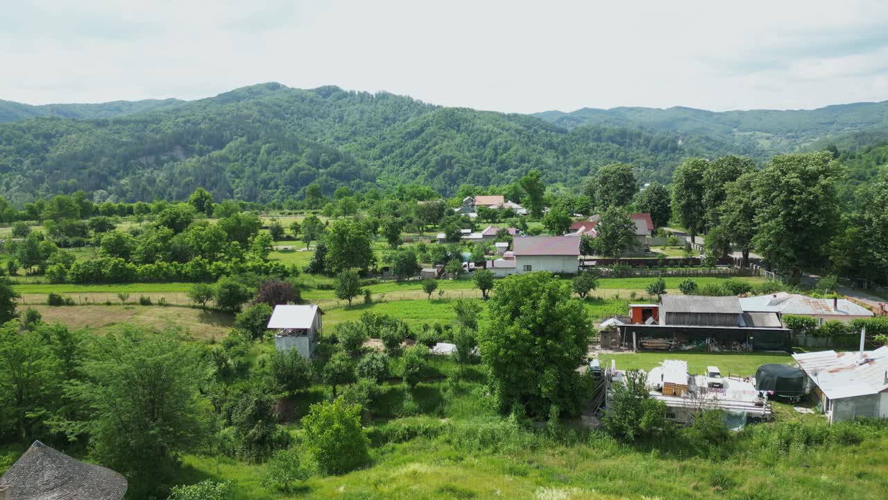 Scenic Rural Town With The 17th-century Mera Monastery In Vrancea County, Romania. Aerial Pullback Shot