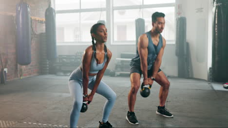 Fitness,-man-and-woman-with-kettlebell