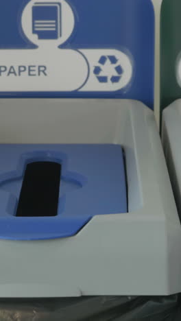 recycling paper into bin