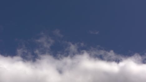 Blue-Sky-With-White-Clouds,-Track-Motion