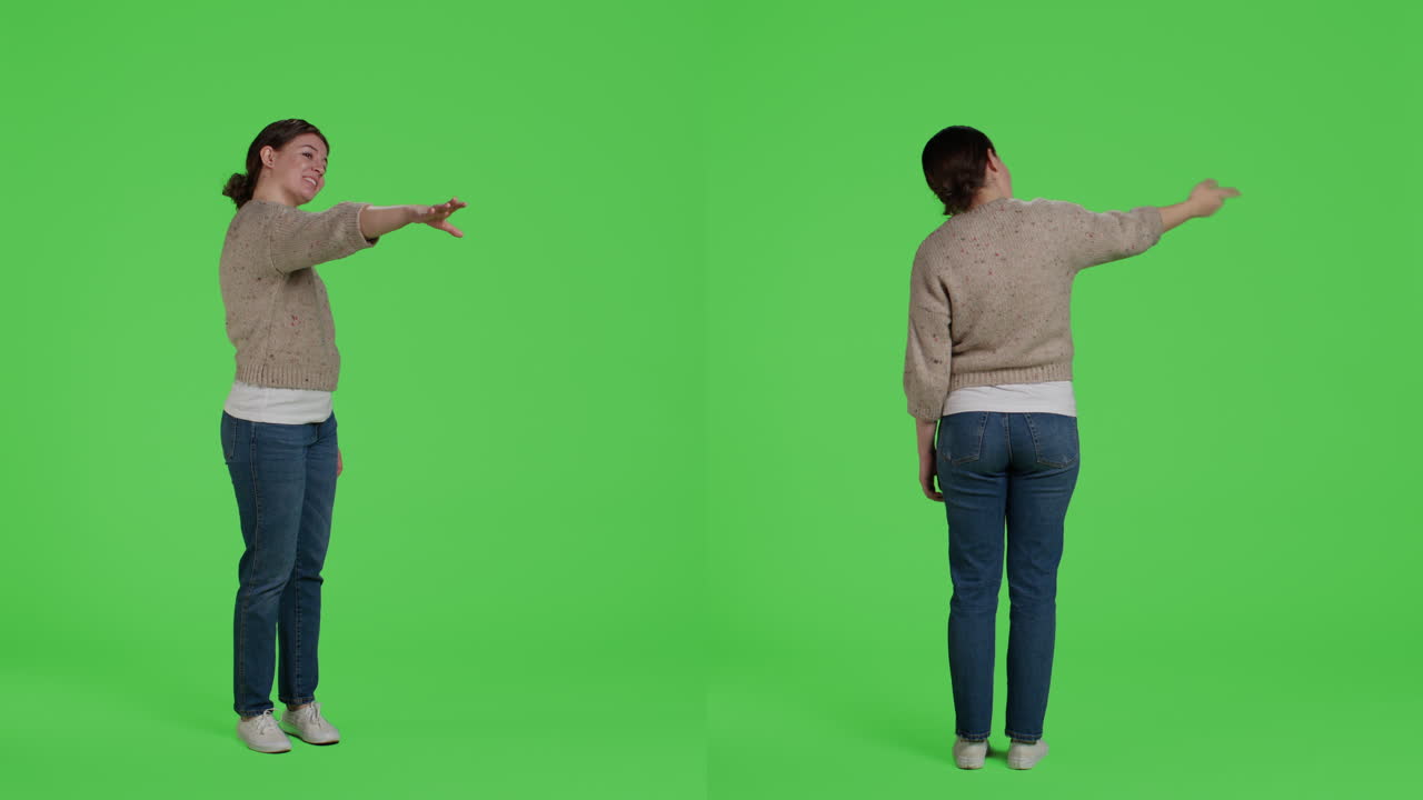 Woman pointing on green screen