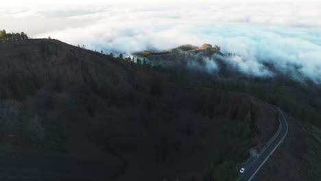 Aerial-view-in-orbit-over-the-Galdar-pines-caldera-during-sunset-and-fantastic-clouds