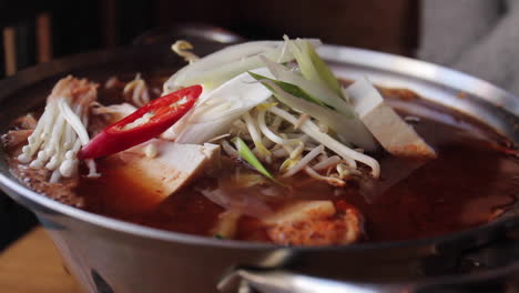 kimchi boiling and bubbling in pot in seoul south korea