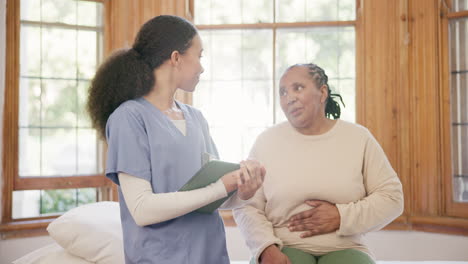 consultation, old woman and nurse with a tablet