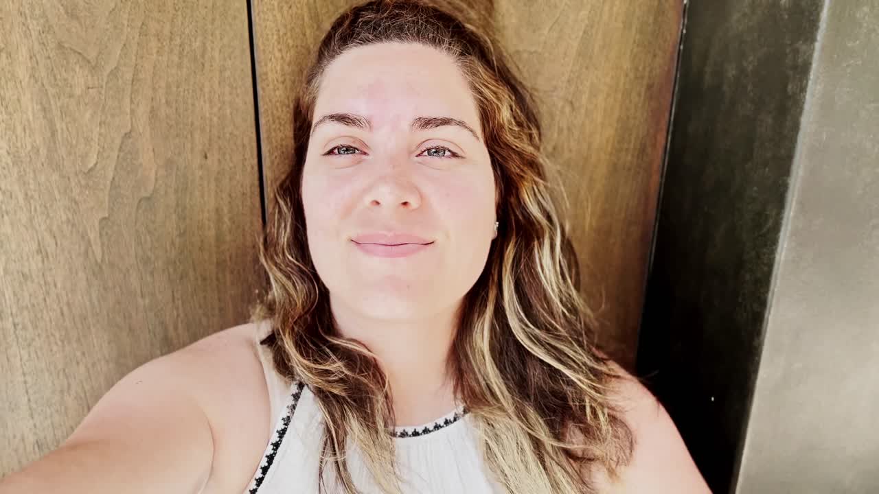 Happy Vlogger with Wind Blowing Through Her Hair