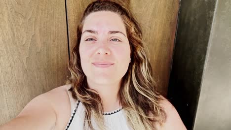 happy vlogger with wind blowing through her hair