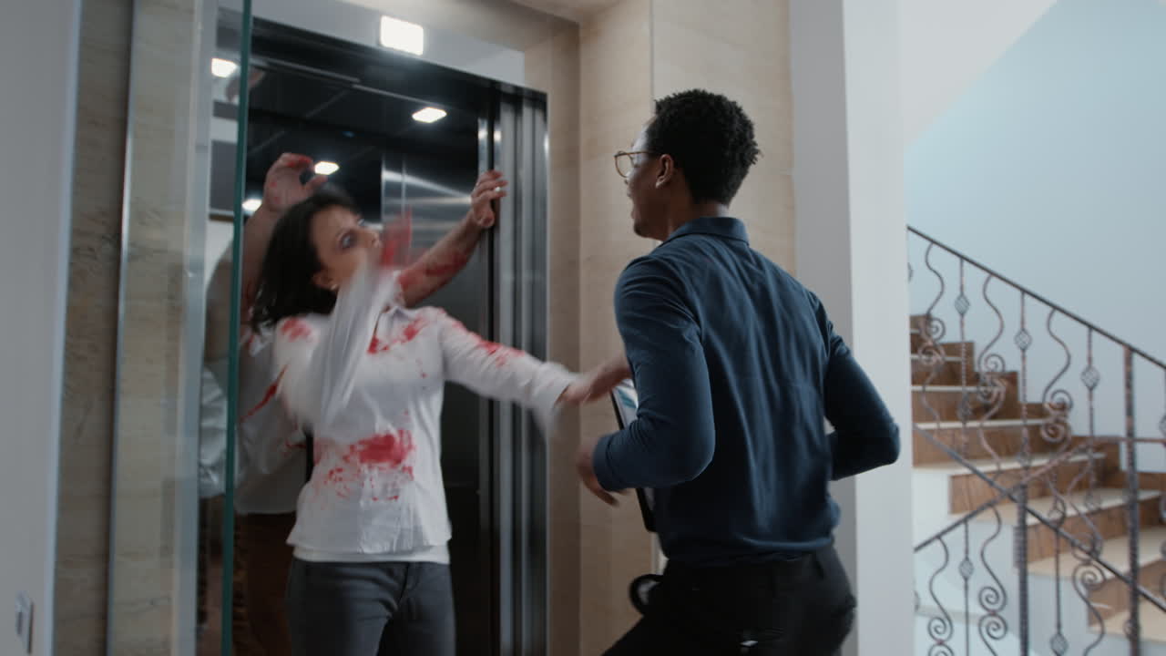 Businessman going downstairs with elevator when creepy dangerous zombies came out of it