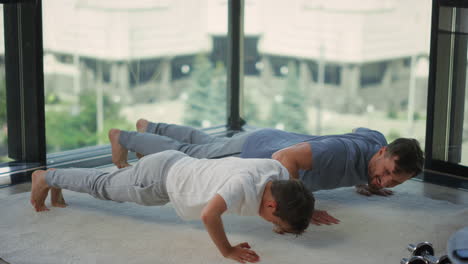 father and son exercising together