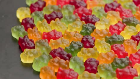 full frame looped spinning background of colorful jelly bear candies