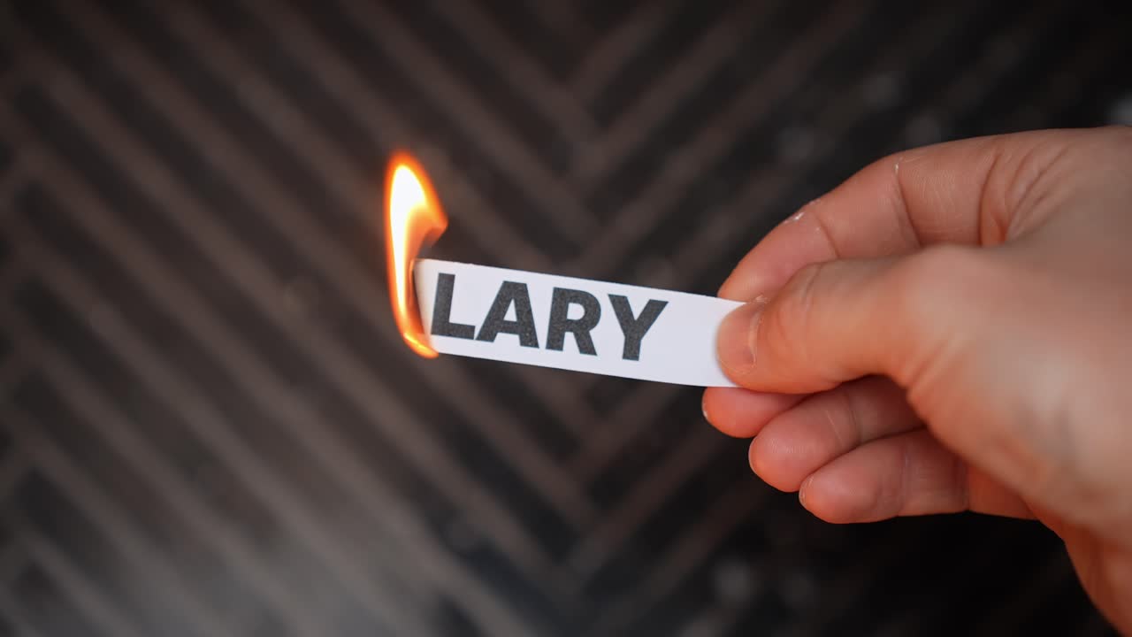 Hand burns a paper label reading “SALARY,” symbolizing leaving paycheck dependence—financial independence, new income streams, and freedom from a fixed wage. Dark copy space