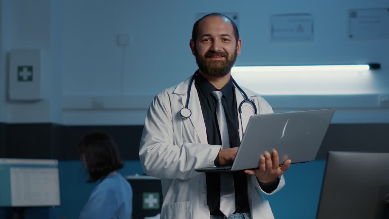Doctor with laptop in hospital