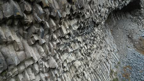 Close-proximity-aerial-at-Symphony-of-Stones,-basalt-cliffs-in-Armenia