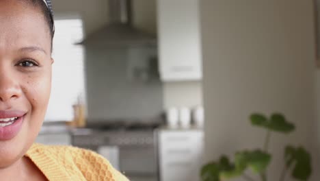 Portrait-of-happy-african-american-woman-looking-at-camera-and-smiling,-copy-space,-in-slow-motion