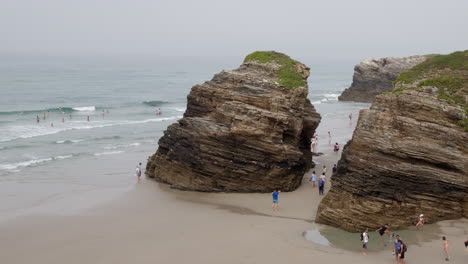 rocky beach scene with people