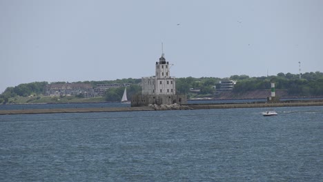 boats cruise through busy harbor