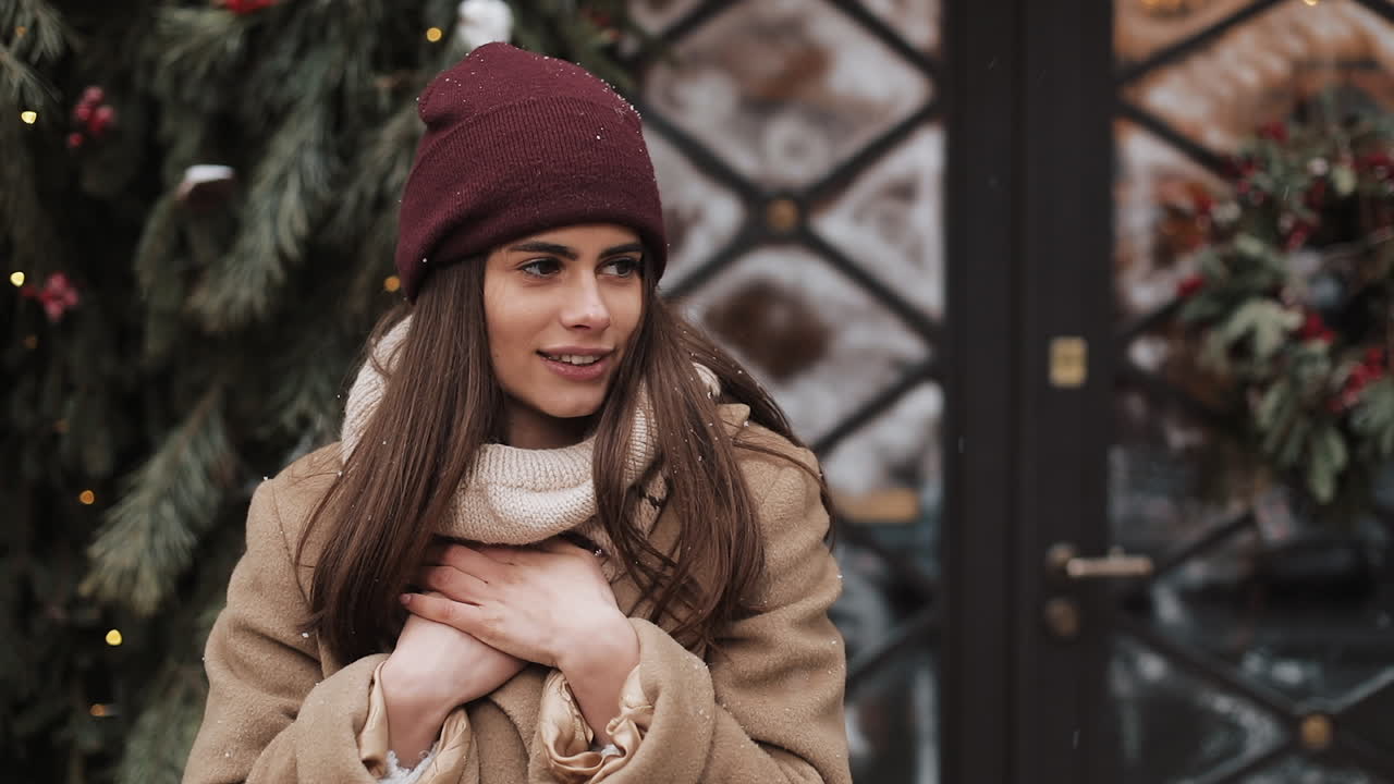 Woman in Winter Coat and Beanie in Snowy Scene