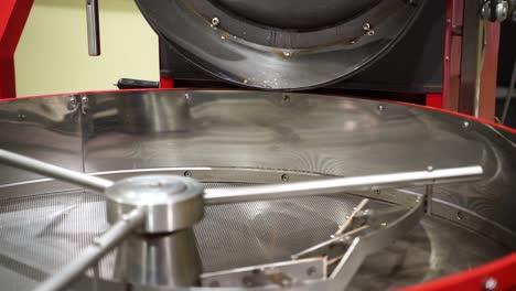 empty cooling tray of a coffee roaster with cooling mixers spinning