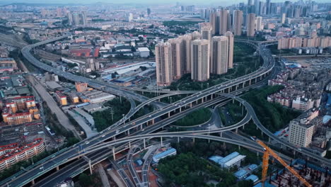 aerial photography of urban atmosphere viaduct busy multilevel interchange overpass in shanghai showing morning traffic flow coming from the elevated roads