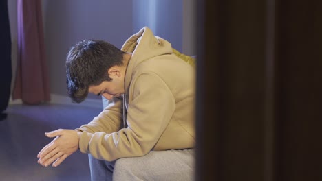 depressed young man thoughtful and worried alone.