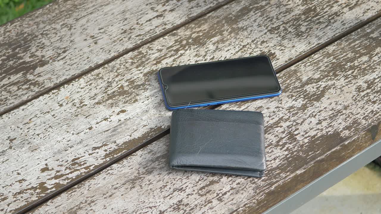 Left wallet on a bench in the park ,
