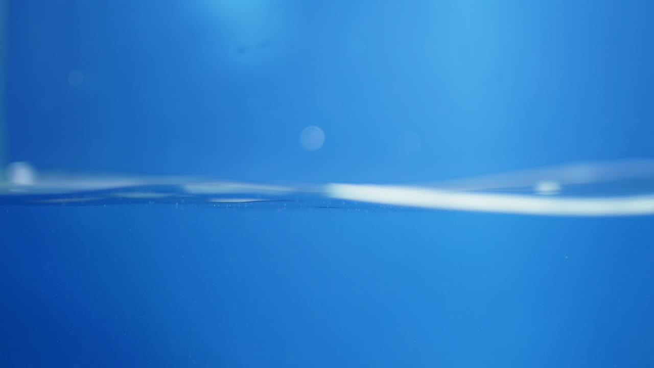 A splash of water in mid-air, frozen in time, showing the energy and purity of nature’s most important resource. Perfect for health and aqua themes.