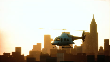 Silhouette-helicopter-at-city-scape-background