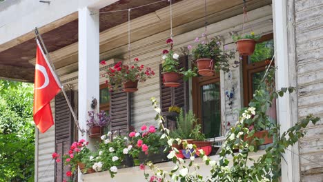 a balcony with flowers and plants in turkey