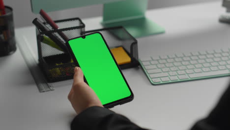 employee holding mockup smartphone in hand closeup. businessman read messages