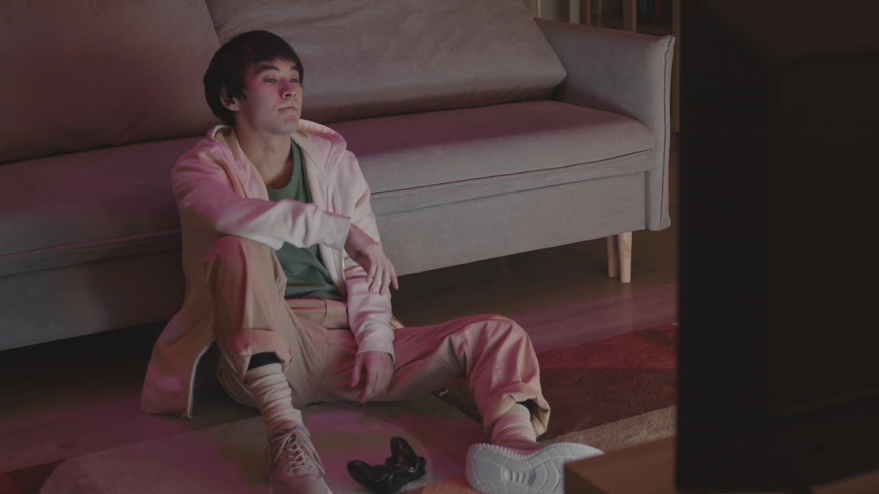 Asian Man Losing in Video Game