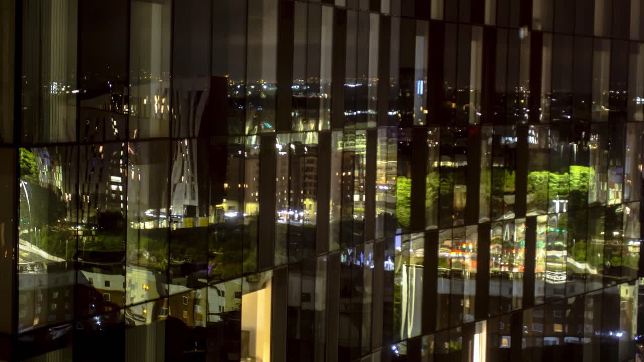 MANCHESTER, UK - 2021: Close up artistic and iconic view of apartments in Manchester UK at Night Time Lapse