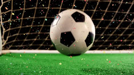 Animation-of-confetti-over-soccer-ball-at-stadium