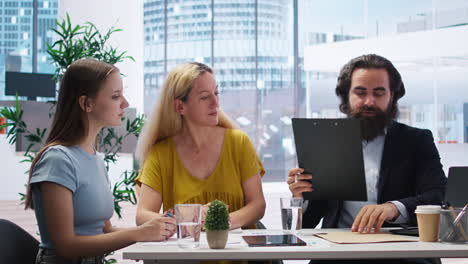 financial advisors meeting with clients to counsel them on their finances