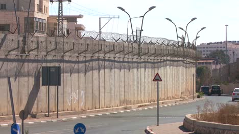 cars drive along the new west bank barrier between israel and the palestinian territories