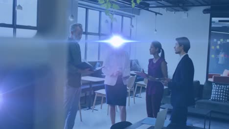 Animation-of-light-spots-over-diverse-business-people-talking