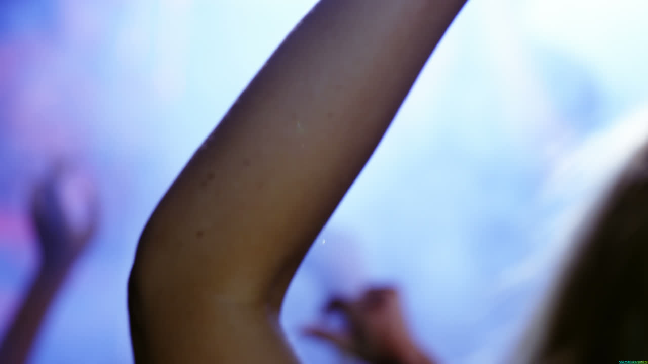 Hands of audience forming heart shape during stage show 4k