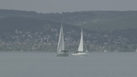 two sails moving side by side