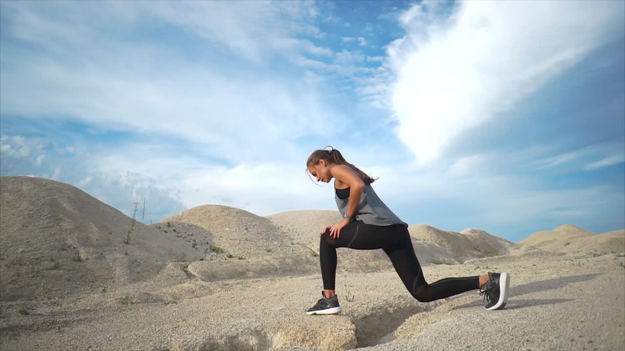 Woman Stretching Outdoors in a Desert Landscape
