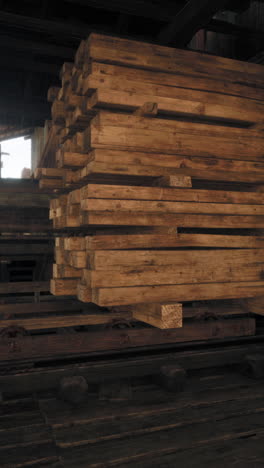 stack of wooden beams in a warehouse