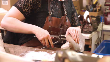 Bespoke-Shoemaker-Pinning-Leather-Together-To-Make-Shoe