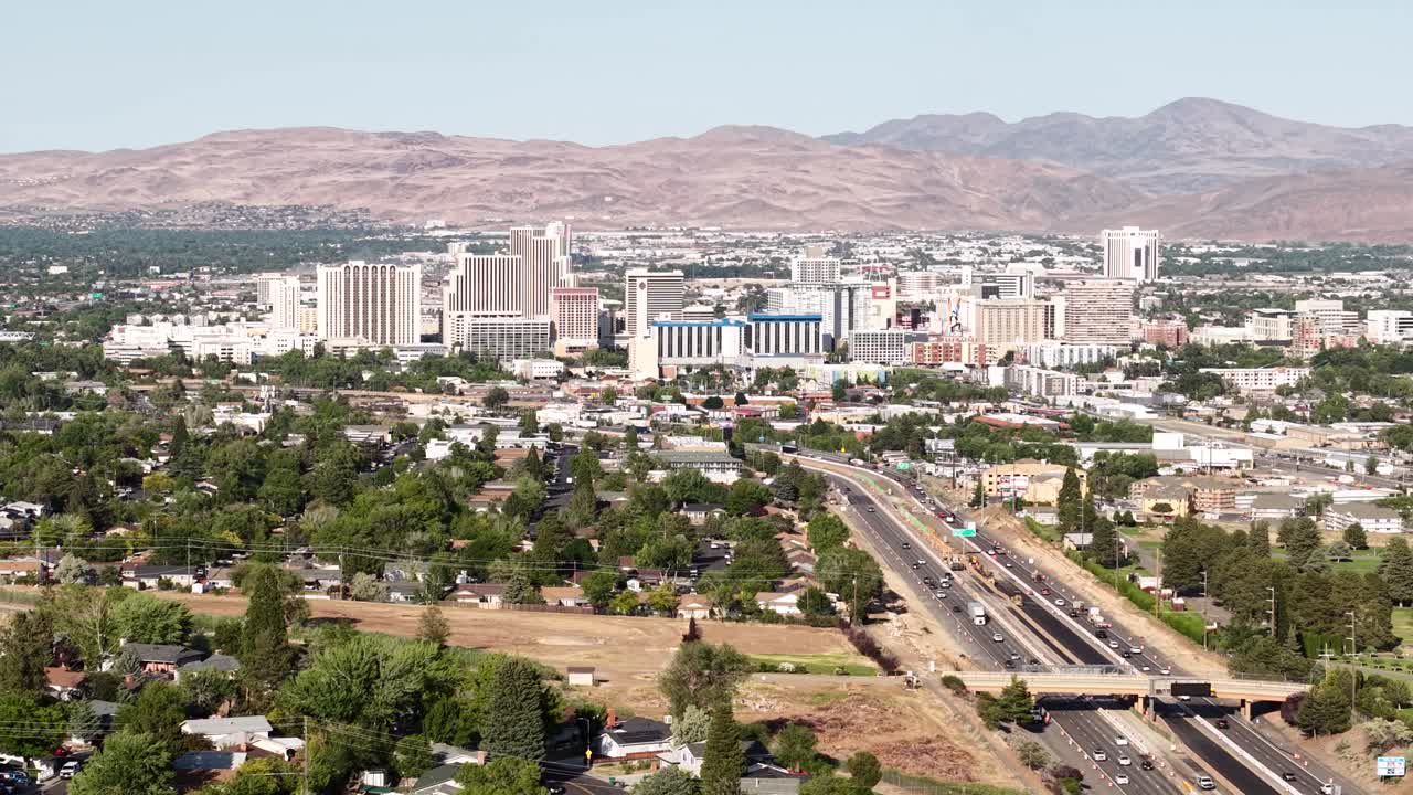 Reno, Nevada USA. Drone Shot of Downtown Cityscape Skyline and Interstate Highway Traffic