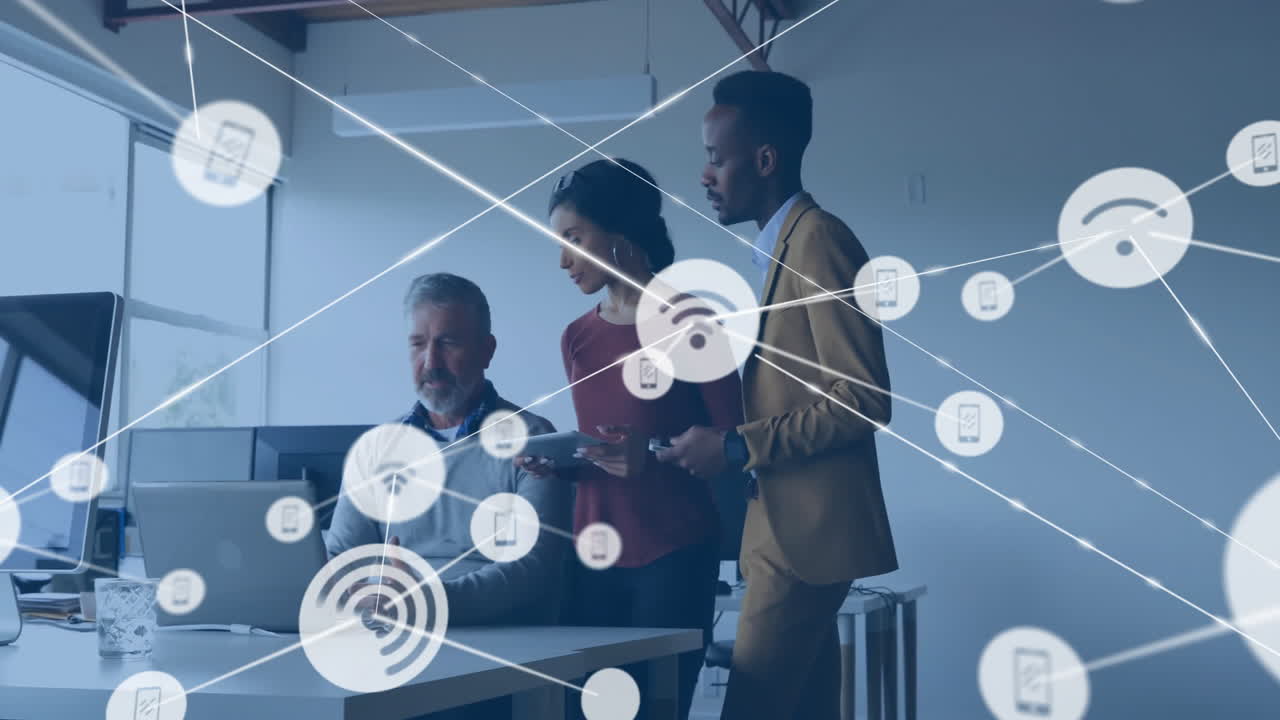 Animation of network of connections with icons over diverse business people discussing work