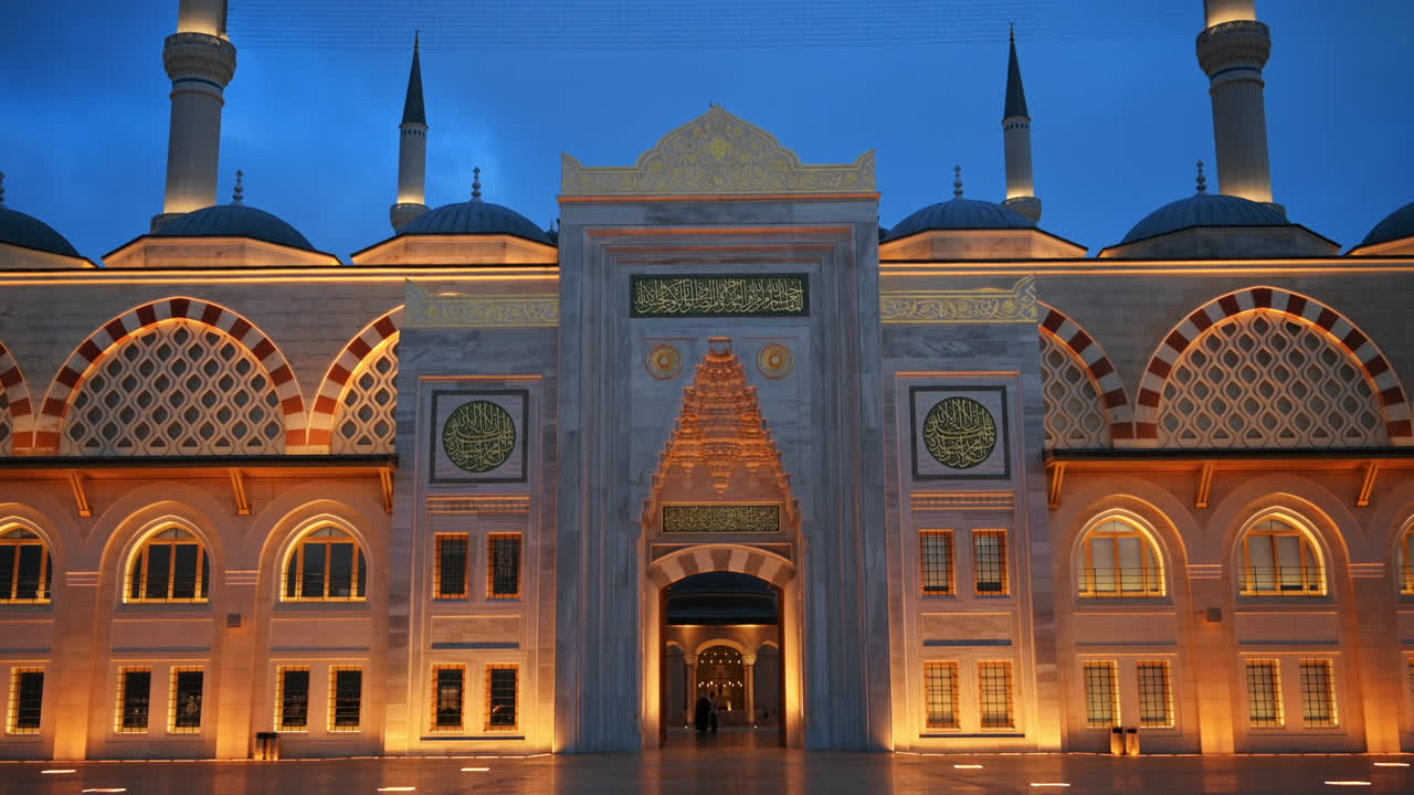 View of the Camlica Mosque in Istanbul at evening, Turkey. Facade made of white stone, illumination