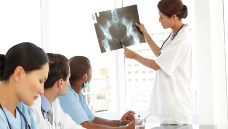 medical team discussing an xray during meeting