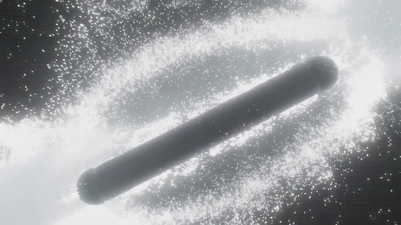 Dopo l'accensione, un singolo cilindro segmentato emette un getto luminoso e rilascia un pennacchio in un vuoto oscuro.