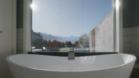 Modern-bath-tub-with-stunning-mountain-and-lake-views