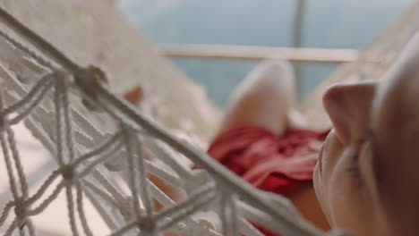 young-woman-in-hammock-enjoying-comfortable-lifestyle-on-vacation-in-holiday-resort-swaying-peacefully-on-lazy-summer-day-in-tropical-paradise-cabin