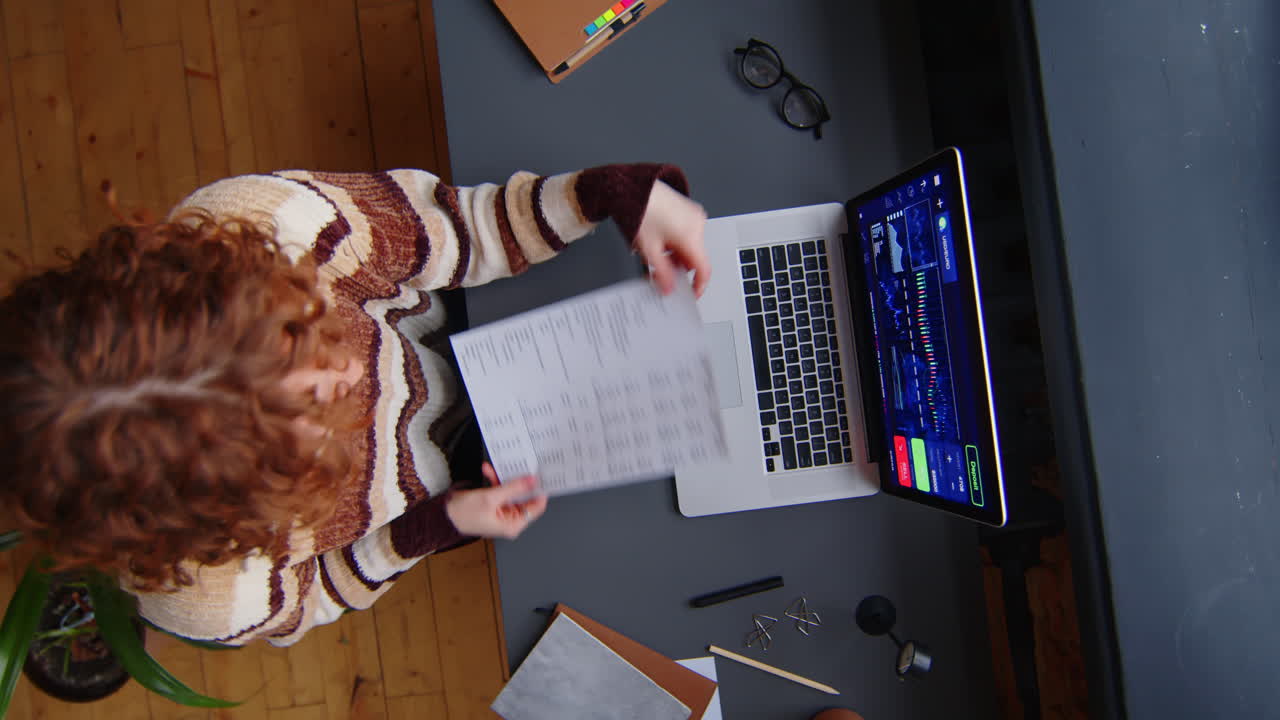 Female Investment Analyst Working in Office at Night