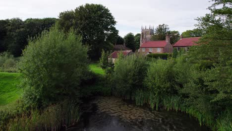 Aerial-video-footage-of-the-remains-of-Bolingbroke-Castle-a-13th-century-hexagonal-castle,-birthplace-of-the-future-King-Henry-IV,-with-adjacent-earthwork